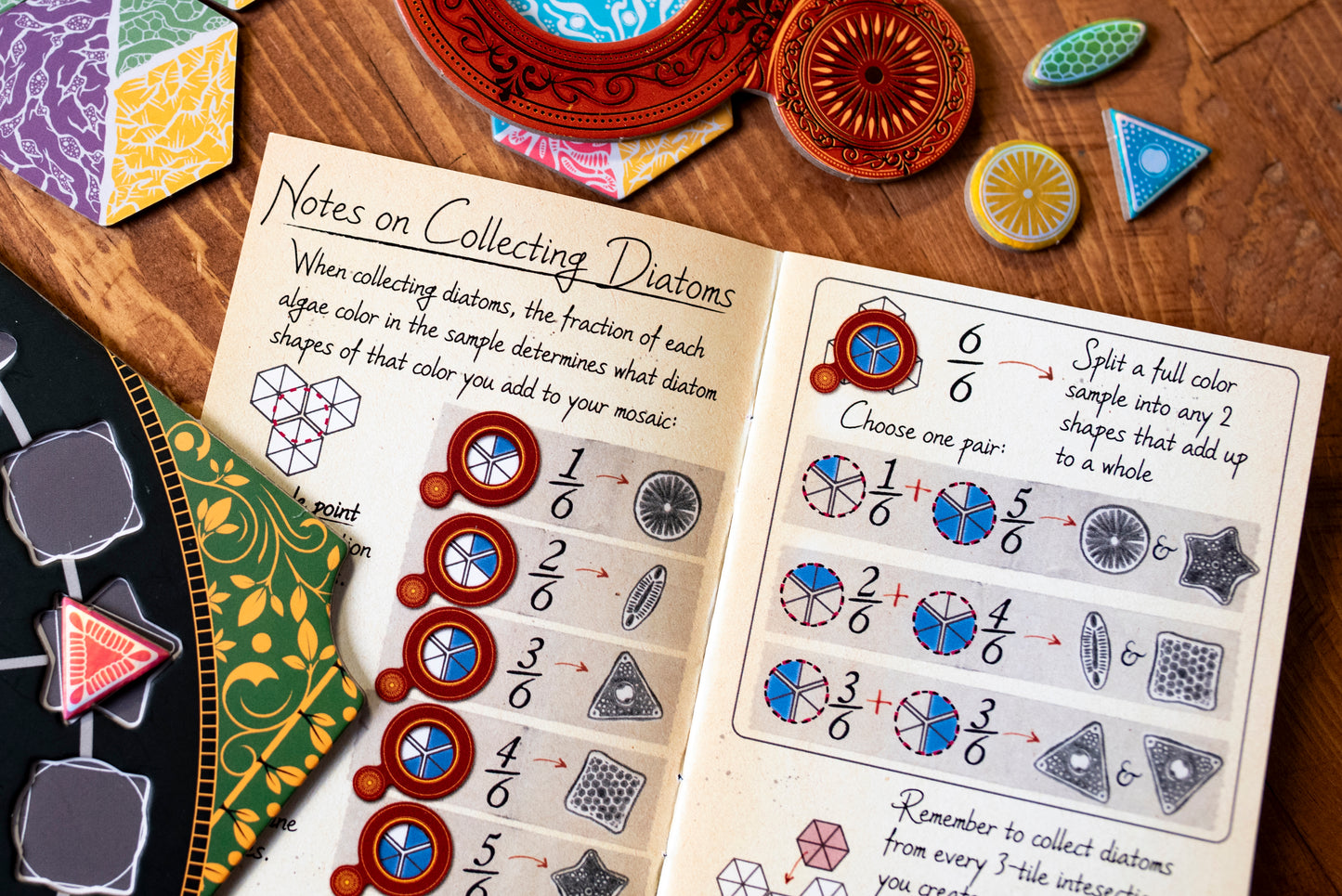 Close-up of the "Notes on Collecting Diatoms" page of the Diatoms player reference notebook with other game components in the periphery.