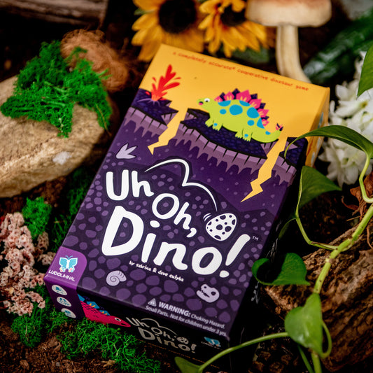 Uh Oh, Dino! game box with a colorful design on a natural background